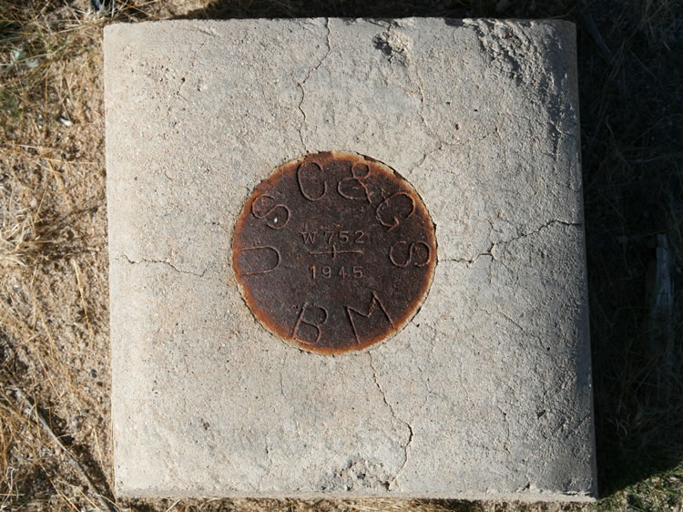 This bench mark is located near the old beacon or tower footings.