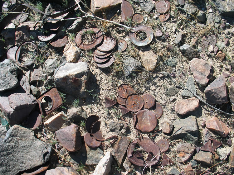 The solid round discs are the caps from the old hole and cap cans.