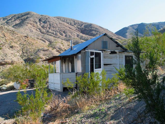 We pass the lower cabin again on the way to the mine.