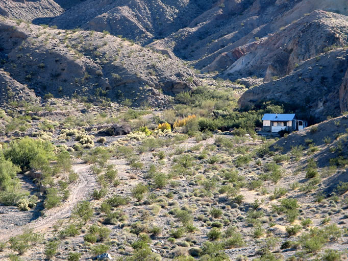 A telephoto of the cabin as we hike back down to the truck.