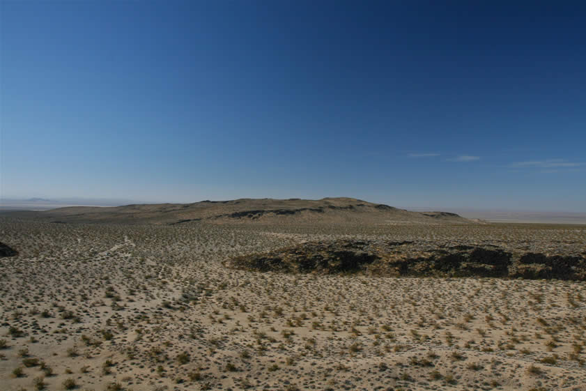 The view from the boulder is expansive.  You can just see the hints of Harper Dry Lake behind the hill in the center of the frame.  When these petros were created this lake was a lush provider of food for the inhabitants of the area.