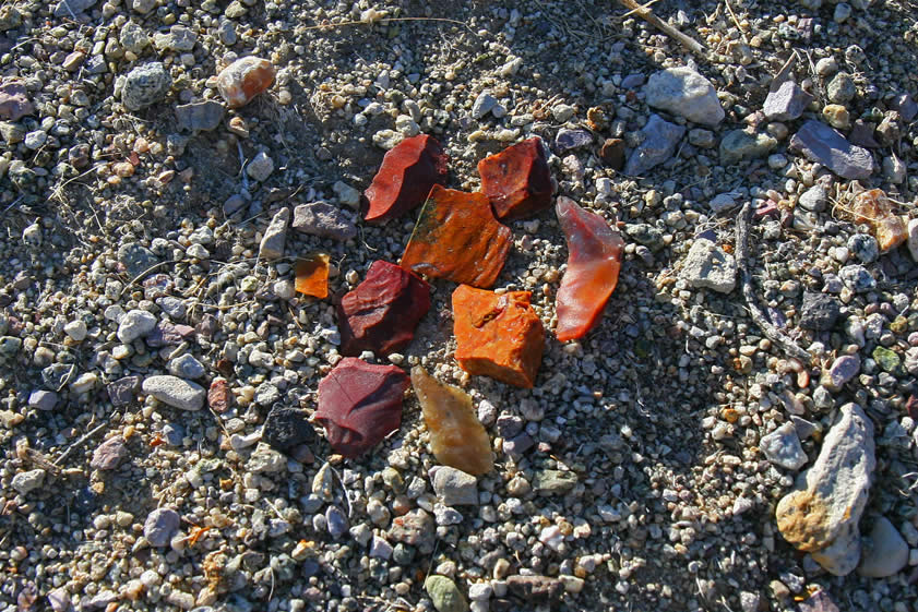 As one might expect, on the nearby clay and sand hills are large areas of flaked and chipped stones from tool making.  This location seems to have been a popular prehistoric campsite.