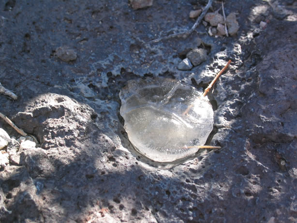 Water still frozen in early afternoon.