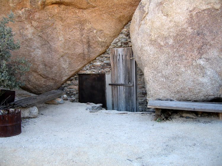 These first views are of the entrance door and screened window set into the mortared rock wall.  With an economical outlay of effort and materials, this prehistoric rock shelter was turned into a cozy cabin.