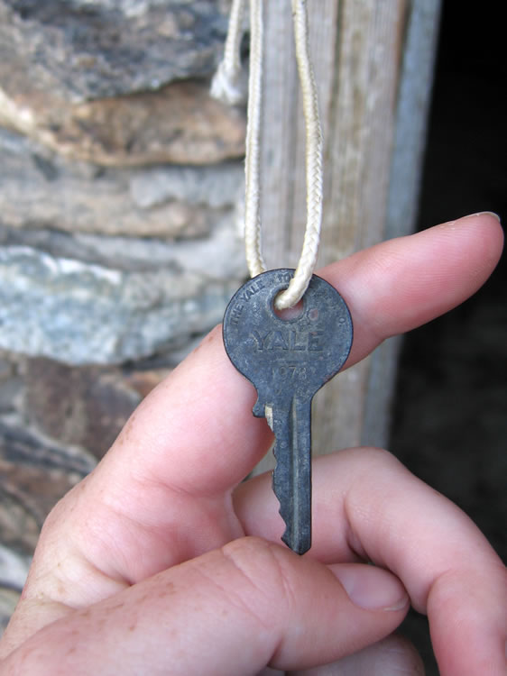 The Yale key we found looped over the latch.