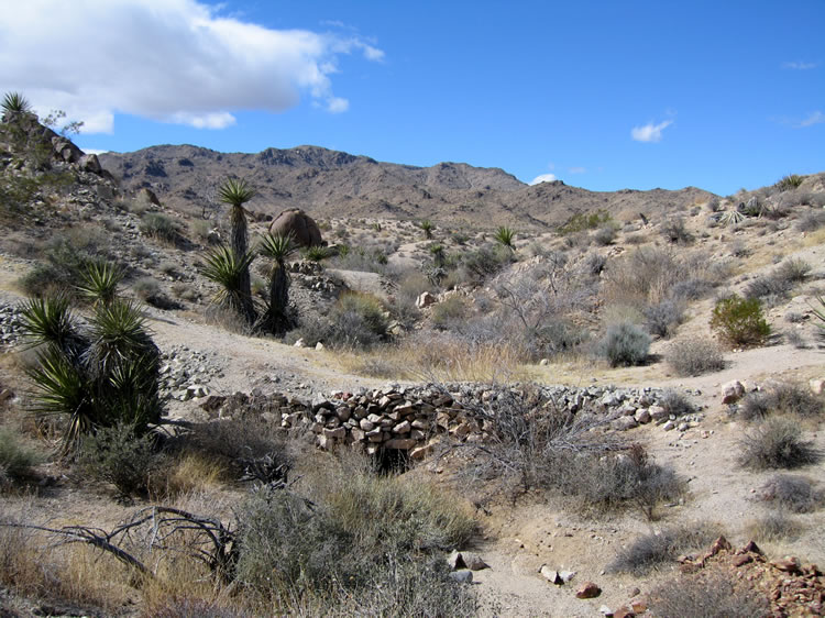 There was once a road to the mine.  This wash crossing has a stone culvert to let water pass under the road.