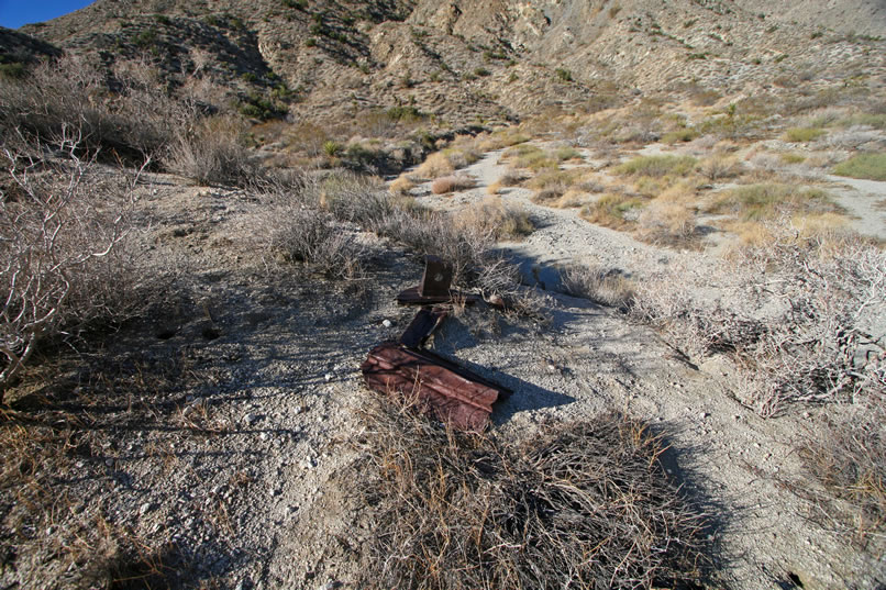 As we approach the wash, we're excited to spot lots of bits of old metal and odds and ends that have been dragged down out of the canyon by flash floods.  It looks like we're on the right track!