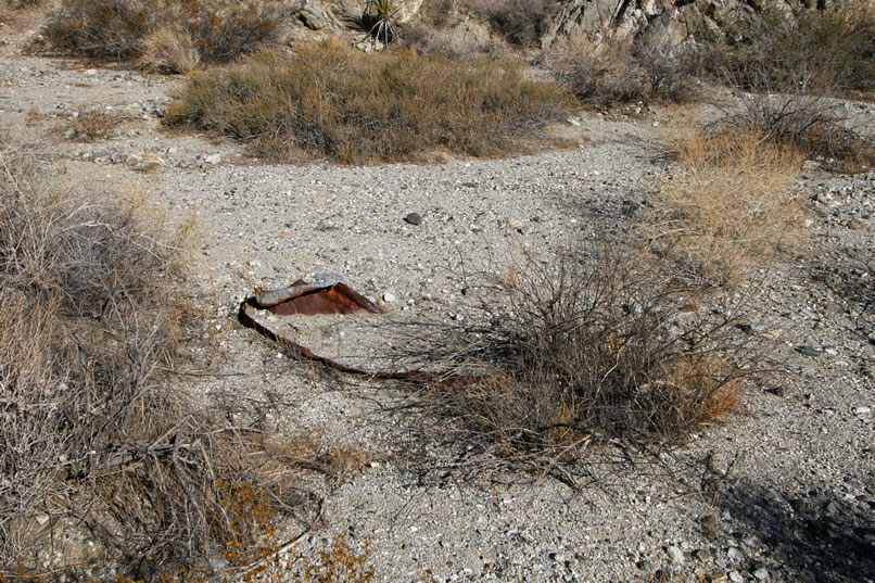 Continuing on our way, we pass what appears to be a metal panel from an old car.