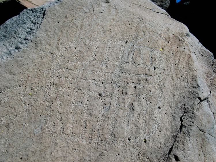 The petros on these light rocks are a real challenge to photograph.  Only a few of the glyphs turn out well enough to reproduce here.  Our biggest lament is not being able to capture the glyph of  a standing figure with an outstretched arm from the end of which emanates a long wavy line.