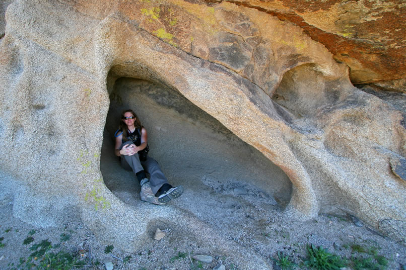 Niki relaxes in the shade of the shelter before we try to track down that old road.