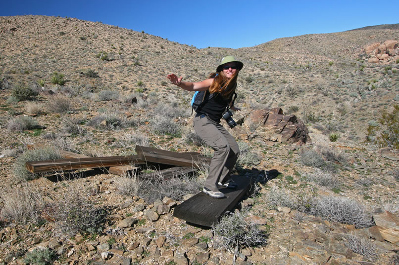 A few timbers are nearby.  Niki catches a good gravel break and rides it all the way into the dirt.