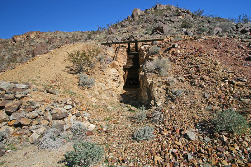 Adjacent to the stacked rock walls is the cut leading to the main inclined shaft.