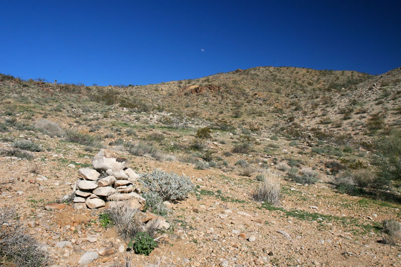 There are several large stacked rock cairns up here as well as a few prospect pits.