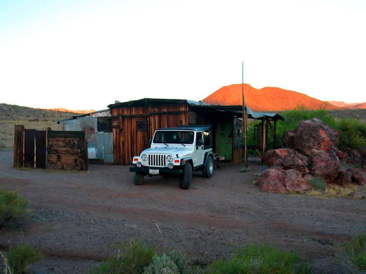 We arrive at the cabin at sunset.  Dan's snakeless Rubi snuggles up to the cabin while the Lizardmobile is out of the frame to the left and Guy's dad and camper are out of the frame to the right.