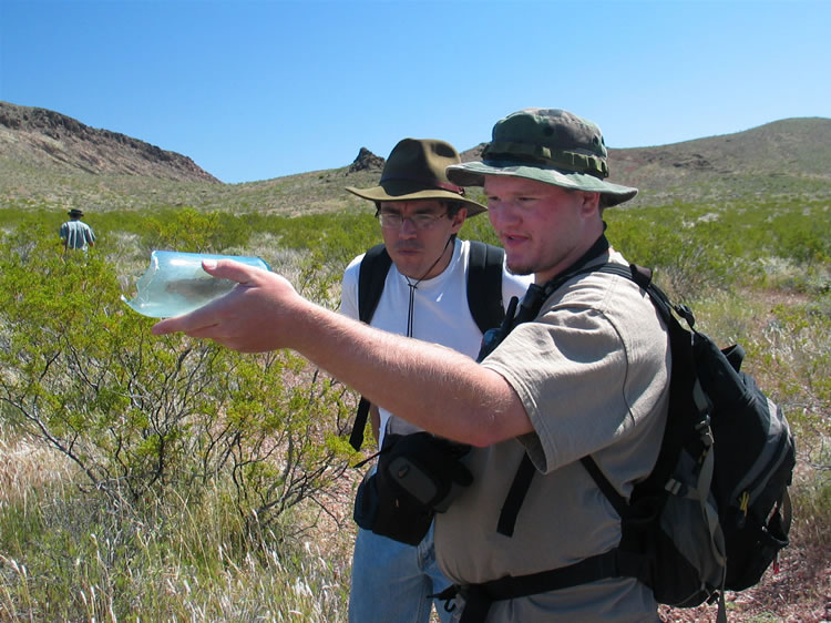 Well, we're off!  Dan shows Guy an old bottle that he discovers near the beginning of the hike.  We'd love to show you some of the scenery, but many of you are way to clever and might pick up clues as to the location of the pictos.  Consequently, all I can say about the route is that it was rugged, long and worth every minute of it!