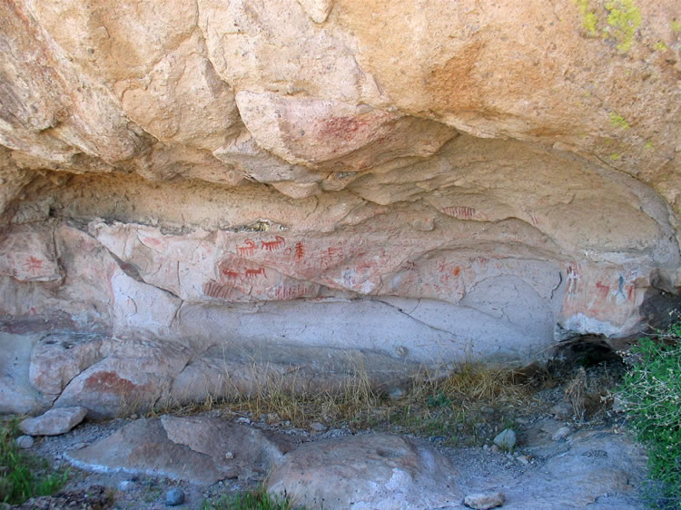 Leaving the first rock shelter, we climb higher still until we come to this second pictograph area.