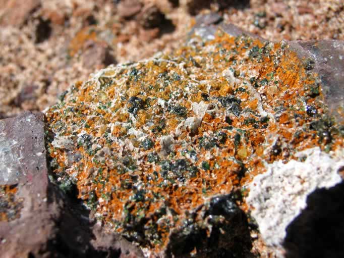 In this rock you can see both peridot and the darker green diopside.