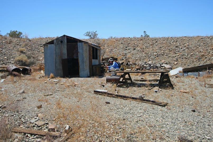 From the 1983 Historic Resource Study of Joshua Tree National Park, we know that the LCS crew found a claim marker that provided a name and location date of 1932 for the nearby Blind Mule Placer.  They also noted that there was a "small metal cabin identical in details to that at the Mystery Mine."  So, although our Mystery Mine cabin is no longer standing, this one seems alive and well!  It was also noted in the report that magazines were found in the cabin here that were dated from the mid-1950's.