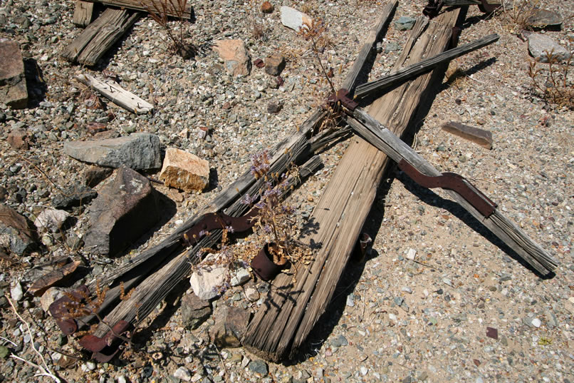 Nearby is a remarkably intact old cot frame.