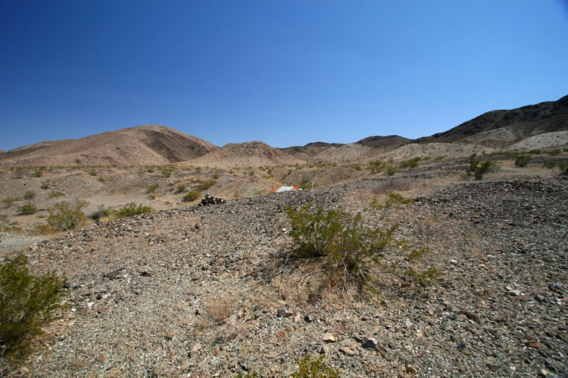 Shouldering our packs again, we climb up out of the wash and take a last look at the well hidden little cabin.