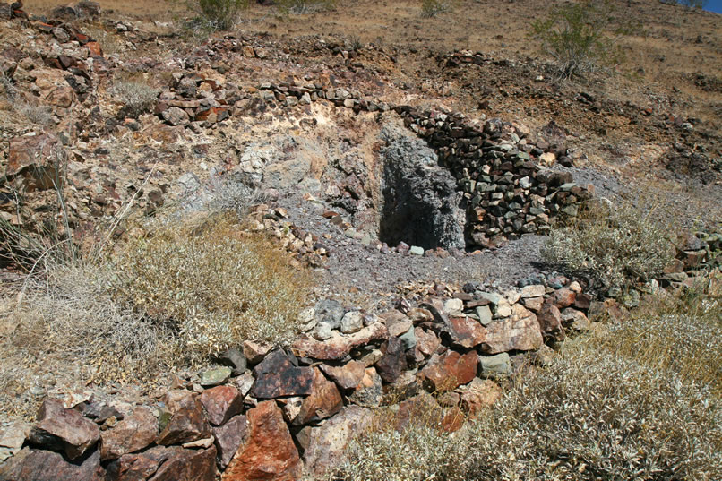 Here's a view of what we can only imagine must have been the "glory hole" of the Blind Mule Placer.  Around it are stacked rock retaining walls, rock outlined paths, and decorative cairns.  We wish we could have met this solitary miner who toiled not just for wealth, but also to add a sense of order and beauty to a claim that he was obviously very proud of.