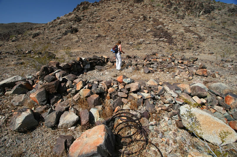 Little is known about the Mystery Mine other than that gold and silver ore was mined in the 1930's from several trenches, shafts and adits.  This stacked stone tent cabin foundation, and another a short distance further up the canyon, seem to be the ruins of the mine camp.  We're a little disappointed that there's no sign of the small metal cabin that we hoped to find.  However, there are lots of trails and it still might turn up!