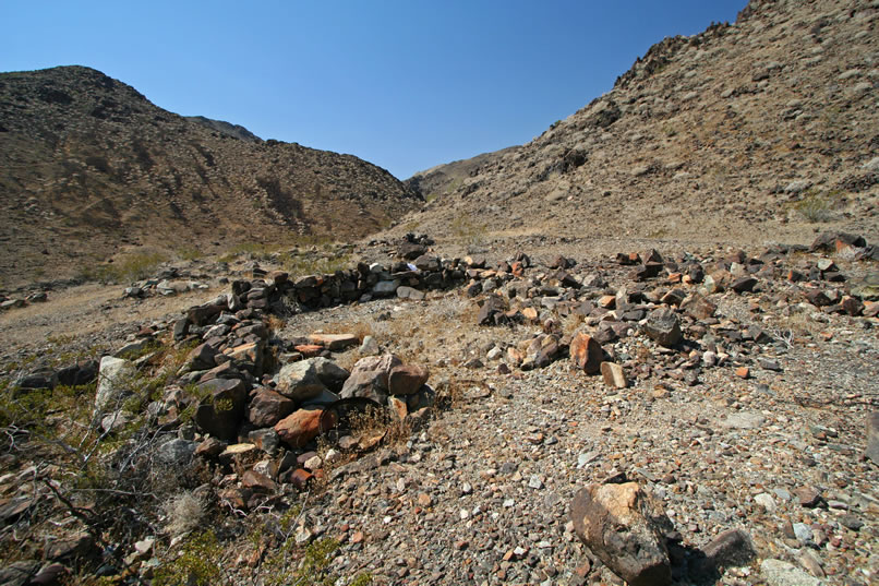 A view up the canyon with the tent cabin foundation in the foreground.