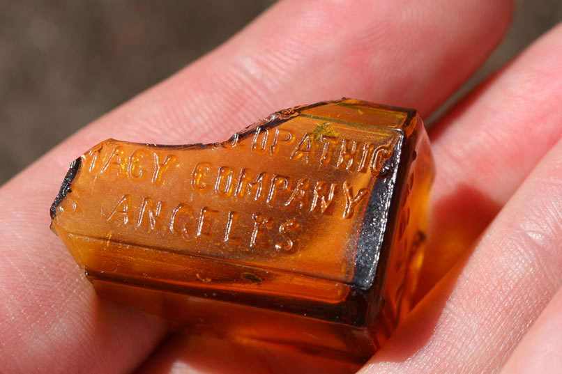 The embossing probably said, "Standard Homeopathic Pharmacy Company, Los Angeles."  This bottle seems to date to around 1904.  
