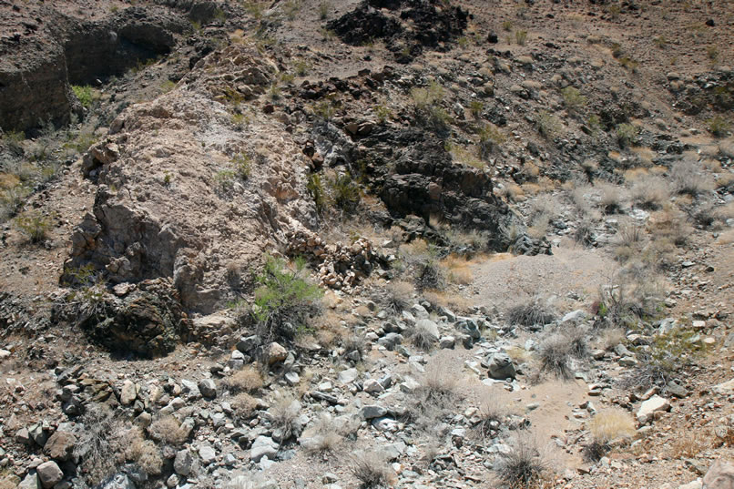 We even spot more light colored stacked rock walls further down the wash.