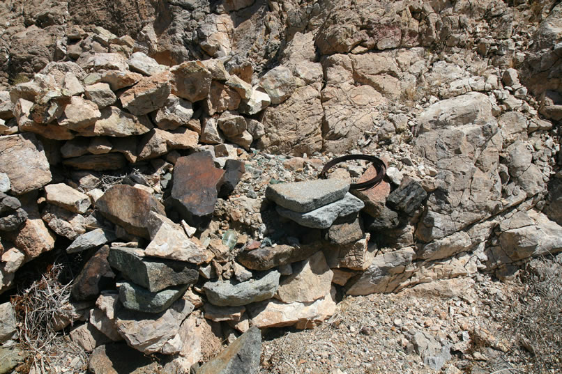 Here's a closer look at where the stacked stone wall abuts the solid rock of the hillside.