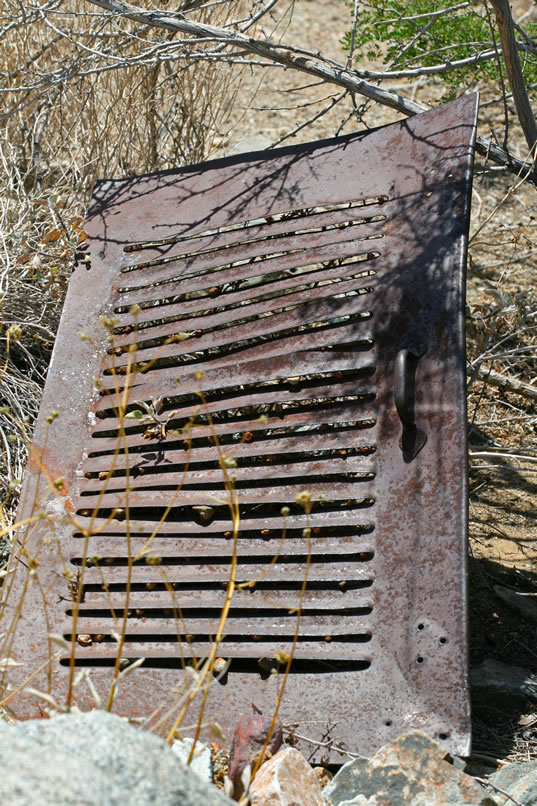 On the way back up to the mine camp, we spot some other discarded items down in the wash.
