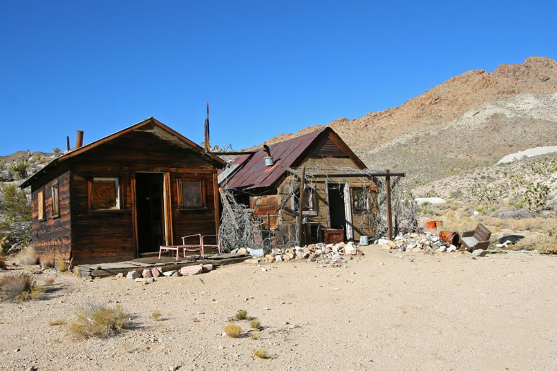 The cabins at New Trail Camp are located on the flats below the New Trail Mine, an early 1900's copper mine.