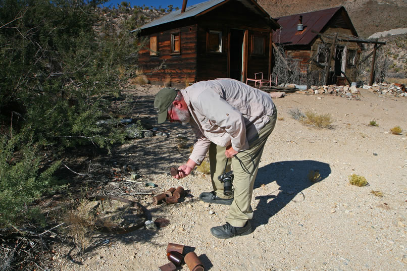 Outside, Mohave is checking on some of the old cans that are scattered around the cabins.