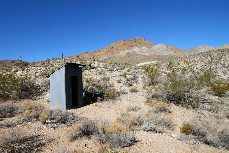 Around back is the obligatory outhouse.