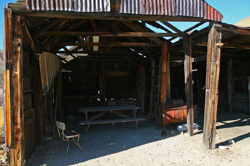 We're only guessing, but it seems likely that the shed was originally used as a workshop and storage shed.  Its modern configuration makes it perfect for those wishing to camp here.