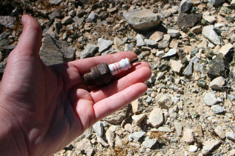 Realizing that we can't access the New Trail Mine from this route, we head back down to the truck.  Along the way we find an old spark plug.