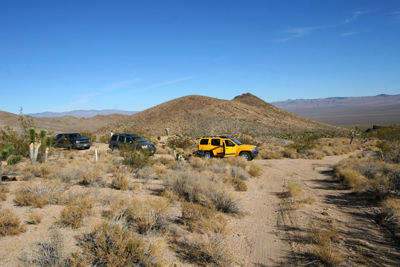 The hill in the background is where we've just left the Hillside Mine, so we haven't had to travel very far at all.  Just behind the vehicles are the scant remains of the mine buildings and shafts.