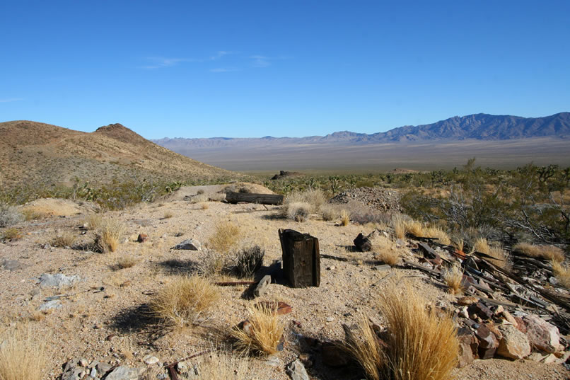 An anvil stump, stacked rock foundations, fallen timbers, chunks of copper ore, old cans and other metal objects, fire brick from a forge and pieces of slag are some of the remains that can be found here.