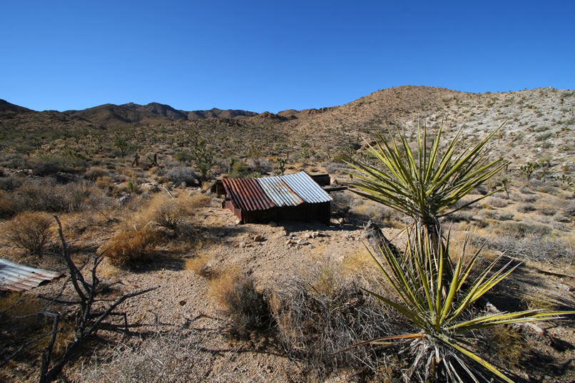 On the north side of the road, just opposite the remains of the Hillside Oxide Copper Mine, is a low shed partially dug into a bank and clad in corrugated sheeting.