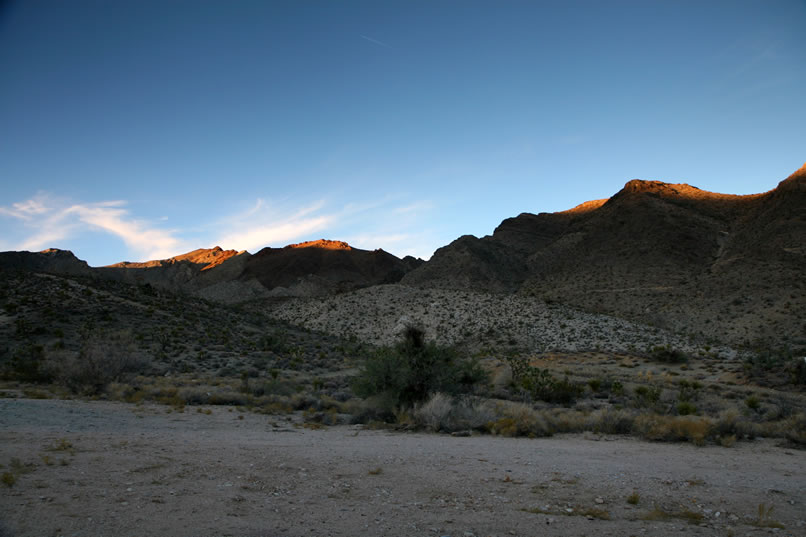 By the time we arrive back at New Trail Camp, only the peaks of the surrounding hills are still bathed in sunlight.