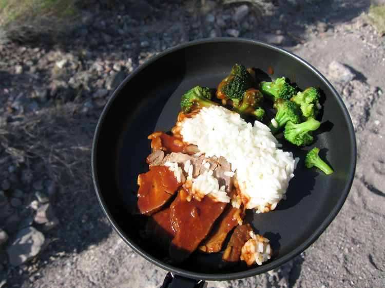 Dinner is cooked in the lee of the truck and we turn in early.