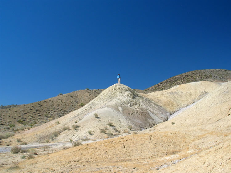 Niki climbs to the top of one of the hills to get a view of the area. 