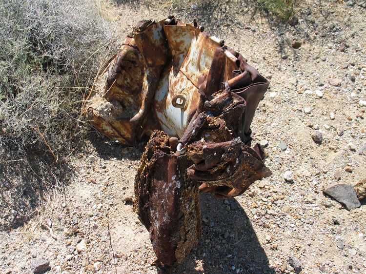 As we head over there we come upon a crumpled piece of metal that doesn't seem to fit in here.  In a short while we'll discover the story behind it.