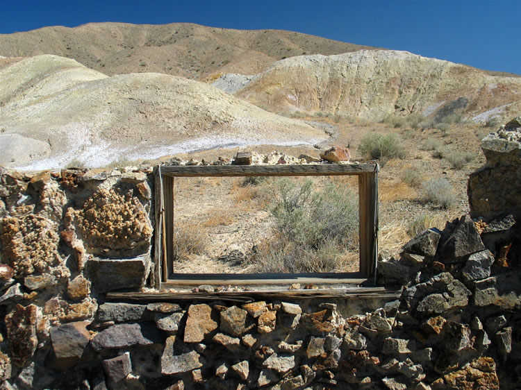 Out behind the cabin are what look like outhouse remains.