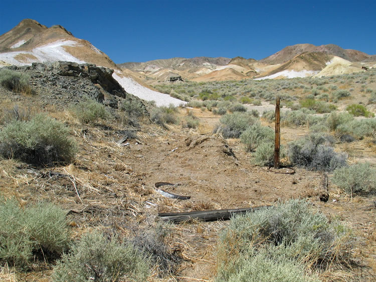 It appears to be the site of a a stable.  There's a pile of organic matter that once could have been hay and there's a low cistern that might have held water.  On a disturbing note, though, we also find lots of large animal bones scattered everywhere.