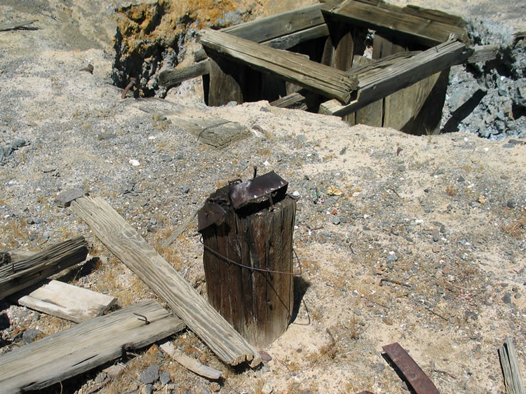 An anvil stump, complete with iron strap, lets us know that a blacksmith once worked here.