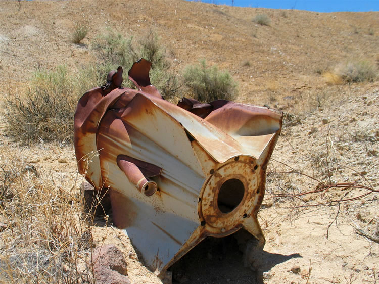 The mystery object was part of a rocket!  In fact, they're all over the place back here!  If you have any info on the type of rocket, please let us know!