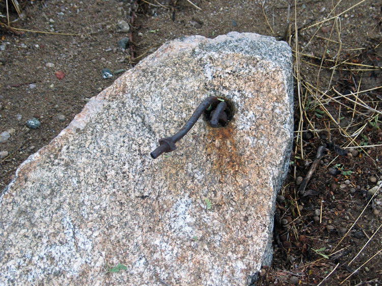 This stone still has the metal fitting which once attached it to the rotating inner spokes of the arrastra.