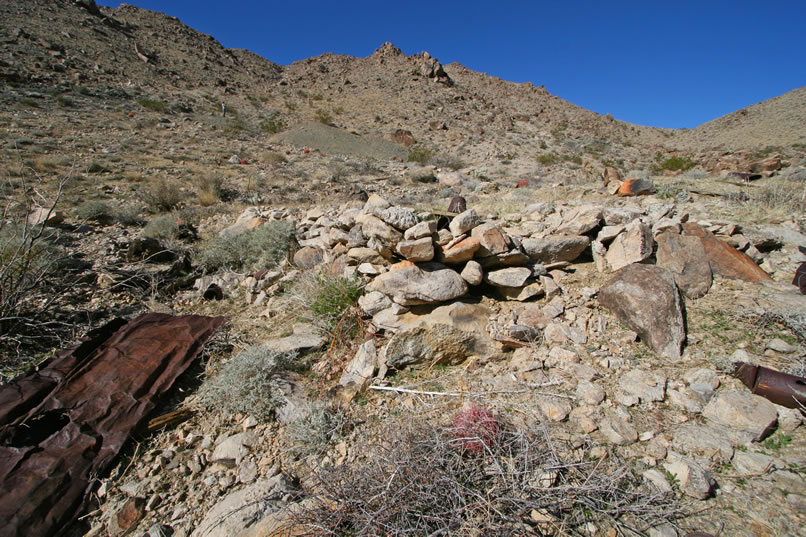 This is another view of the stacked stones at the edge of the flat.  Can you find Niki up to the left of the tailings pile?