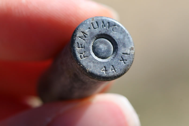 The cartridge was so popular back around the turn of the century, that several firearms were specially chambered for it.  These were mostly single shot guns.  The most famous of these was the Marble's Game Getter.  It was a single shot, over and under double barrel affair.  The two barrels were 12" long.  The upper barrel was chambered in .22 long rifle, and the lower was chambered for the .44 XL center fire cartridge.  Since the shell case that Niki found hasn't been fired, we guess that it was dropped and in the one hundred or so years the paper shot container disintegrated, allowing the shot as well as the smokeless powder charge to scatter into the ground.  This was a neat little find!